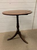 A side table on turned centre support on sphere feet (H68cm Dia55cm)