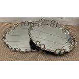 A pair of mirrored chrome trays with a horse bit design to edge (Dia45cm)