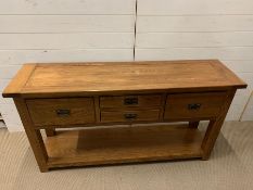 A light oak sideboard with large drawers to ends and two small drawers to centre (H80cm W150cm