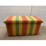 An upholstered blanket box with original handles