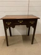 An oak lowboy with entrant corners, three small drawers on straight legs AF (H77cm W83cm D48cm)