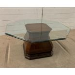 A glass top hexagon side/coffee table on an interesting mahogany base (42cm x 91cm)