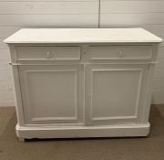 A white painted cupboard with two drawers and cupboards (H96cm W128cm D51cm)