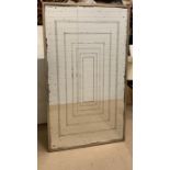 A contemporary wall mirror with faux foxing and metal frame (170cm x 97cm)