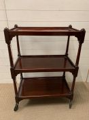 A mahogany three tier trolley with turned supports (H95cm W70cm D40cm)