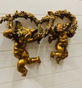 A Pair of Decorative wall mounted Cherub figures.