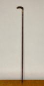 A bone handled quality walking cane or swagger stick with 18 ct gold collar