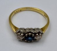 An 18ct three stone ring (3.7g) Size P