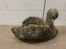 A garden concrete swan planter