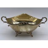 A silver two handled bowl on four legs, marked 830. Total weight 103g.