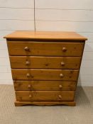 A pine chest of drawers made up of five long drawers (H86cm W75cm D40cm)