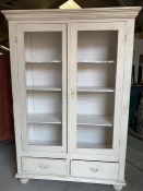 A two door display cabinet with wire front and two drawers under on bun feet (H198cm W135cm D45cm)