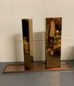 Two Kose Milano ceramic vases and tray in a polished bronze effect (H50cm W15cm and H49cm W7cm)