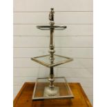 A chrome and glass three tier cake stand