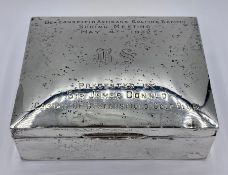 A Hallmarked silver engraved cigarette box.