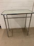 A mirrored side table on metal industrial legs (H78cm W76cm D44cm)