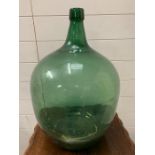A green large carboy bottle