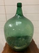 A green large carboy bottle