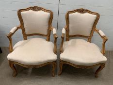 A pair of French style open armchairs