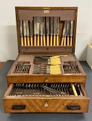 An eight place setting Elkington silver plate cutlery set in a wooden canteen box