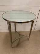 A chrome contemporary table on tri form base (H66cm Dia56cm)