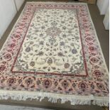 A large pink and cream ground rug W218cm x L336cm