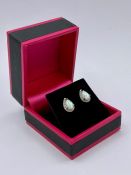 A pair of pear shaped opal and CZ stud earrings