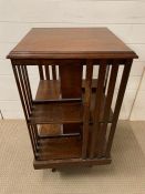 An Edwardian oak revolving library bookcase