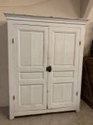 A pine painted double door cupboard opening to reveal shelfs (H200cm W162cm D40cm)