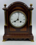An Eight Day Maple & Co mantle clock in mahogany.