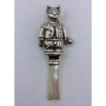 A Silver Babies rattle in the form of Tom Kitten