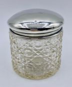 A Silver lidded cut glass container, Birmingham 1920, makers mark TW