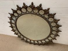 A circular metal wall mirror with smaller circular mirrors to edge (Diameter 110cm)