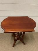 A mahogany side table on four legs and middle centre piece (H67cm W59cm D38cm)
