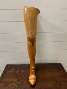 A wooden vintage prosthetic leg