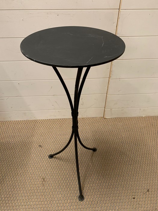 A metal round side table