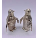 An unusual pair of silver plated Penguin condiments