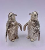 An unusual pair of silver plated Penguin condiments