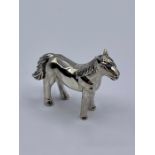 A silver figure of a horse