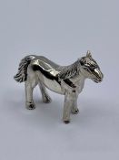 A silver figure of a horse