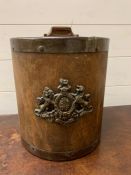 A wooden lidded storage container with Royal Crest to front (H25cm Dia 22cm)