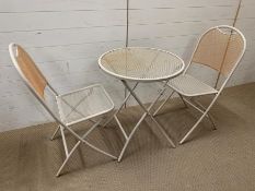 A metal bistro set with two chairs, mesh design