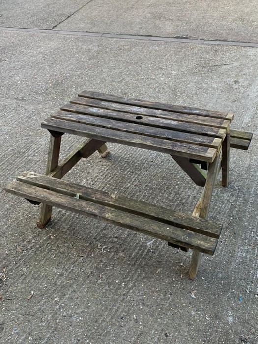 A wooden picnic bench AF