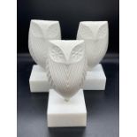 A set of three owl sculptures on plinths by Jonathan Adler (H23cm Sq10cm)