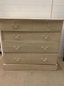 An antique painted pine chest of drawers (H96cm W105cm D50cm)