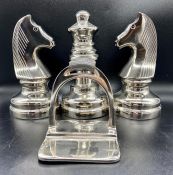 A selection of decorative bookends, some chess themed