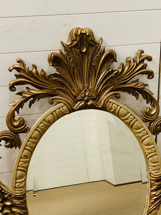 A 20th century giltwood oval mirror with floral carving - Image 3 of 7