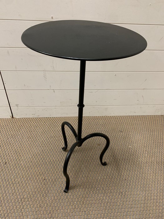 A black metal side table (H66cm Dia33cm)