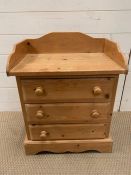 A pine bedside with three drawers (H60cm W50cm)