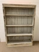 A distressed style bookcase (H147cm W100cm D28cm)